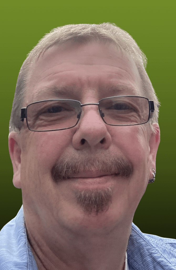 An image of Andy Britton smiling.